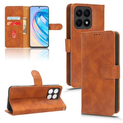 For Honor X8a Skin Feel Magnetic Flip Leather Phone Case(Brown) - Honor Cases by buy2fix | Online Shopping UK | buy2fix